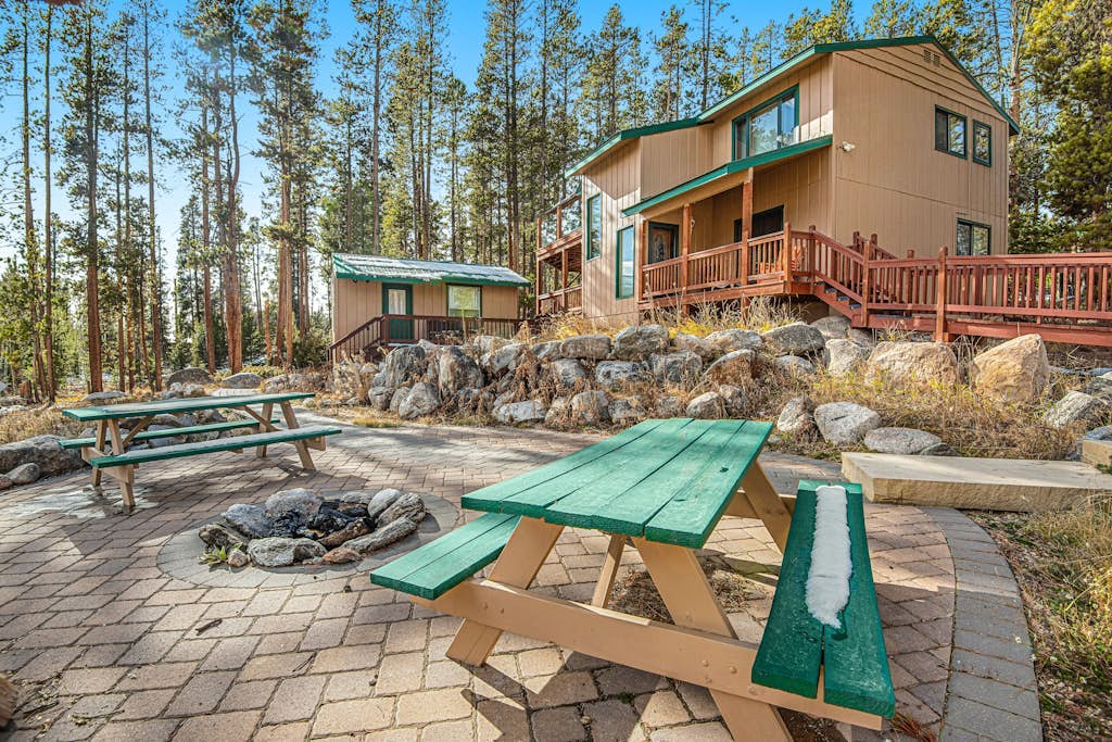 Tree-lined retreat with a wood stove, patio, & studio cottage with a kitchenette