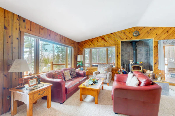 Tree-lined retreat with lake views, wood stove, and private washer/dryer