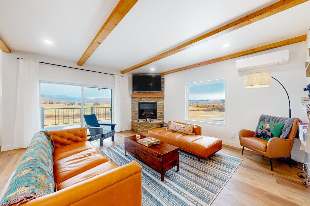 Dog-friendly golf course-front home with mtn & ski views, fireplace, & balconies