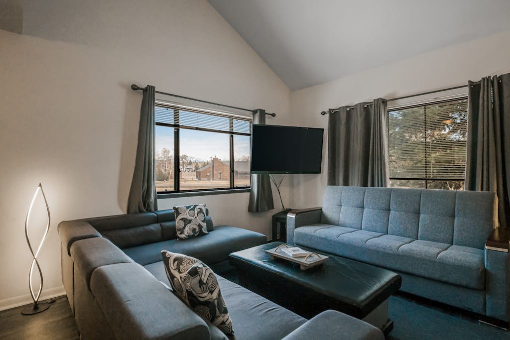 Two-Level Condo w/ Mountain View, Wood Stove, WiFi, Laundry & Central Location