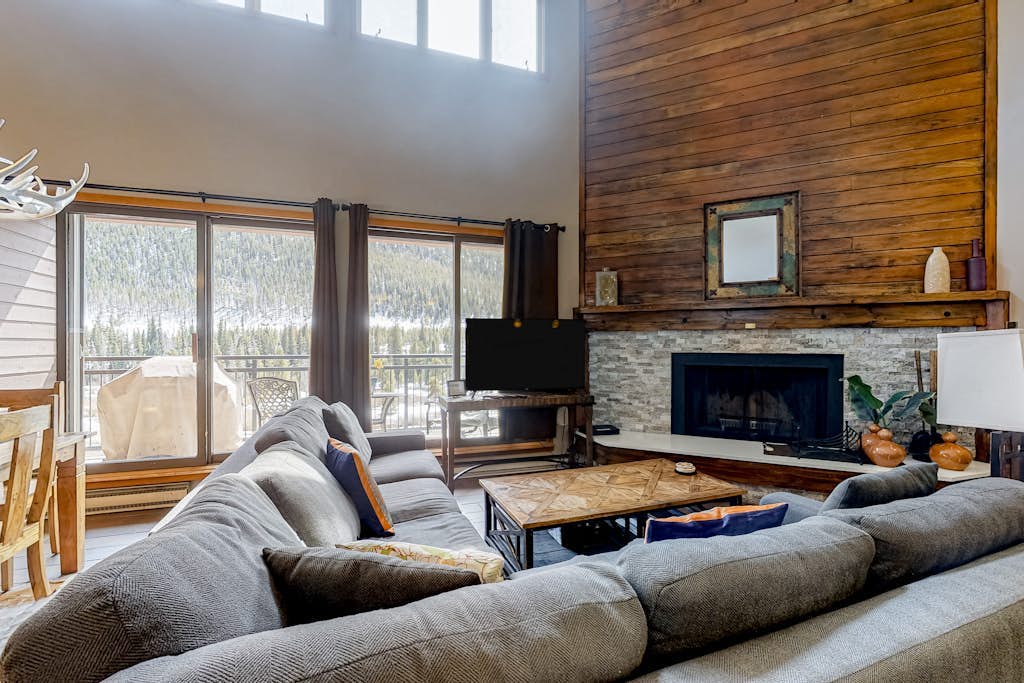 Water-view escape near the slopes with mountain vista, balcony, & fireplace