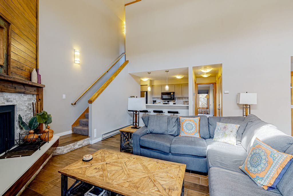 Water-view escape near the slopes with mountain vista, balcony, & fireplace