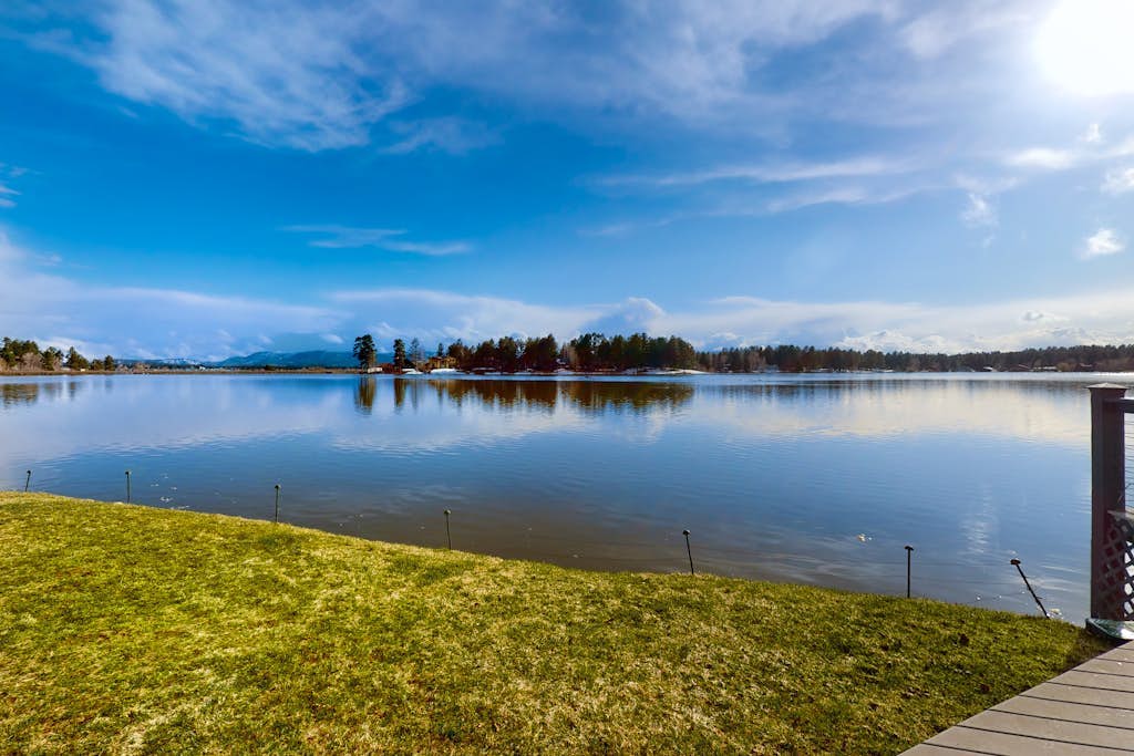 Stunning lake house with dock, firepit, grill, canoes, & mountain views