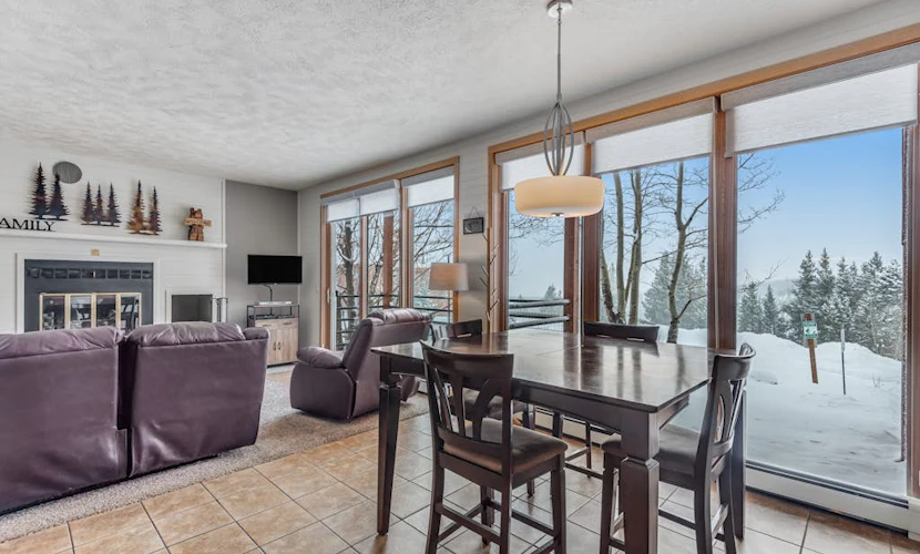 Ground-level condo with clubhouse offering pool, hot tub, tennis, & games