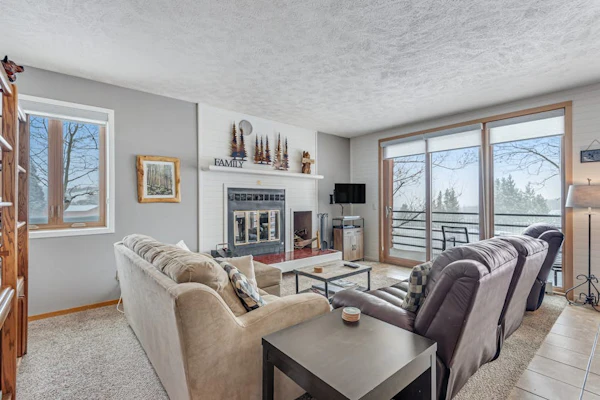 Ground-level condo with clubhouse offering pool, hot tub, tennis, & games
