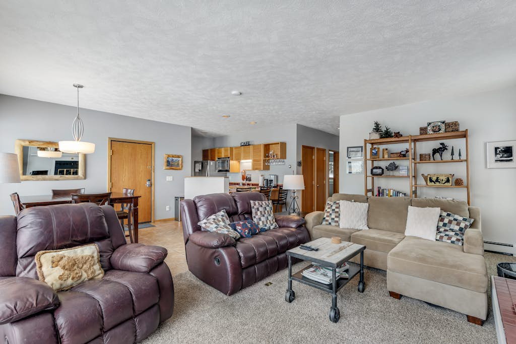 Ground-level condo with clubhouse offering pool, hot tub, tennis, & games