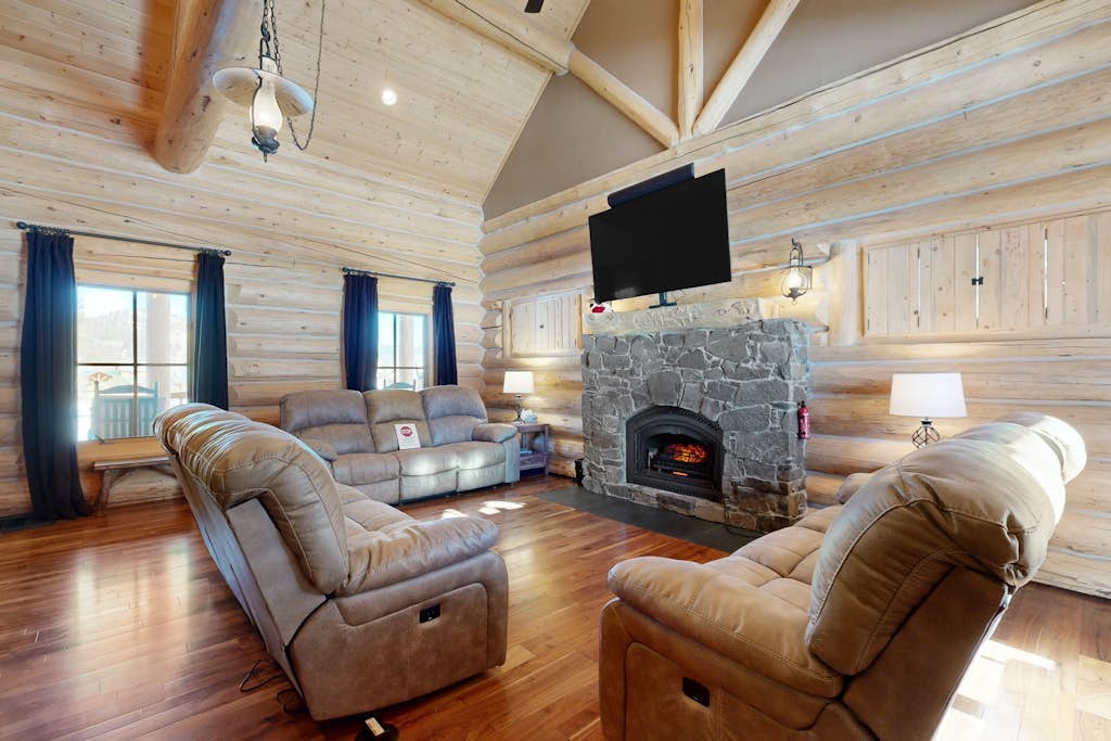 Charming cabin surrounded by trees with deck, grill, fireplace, games, & W/D