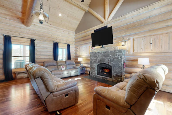 Charming cabin surrounded by trees with deck, grill, fireplace, games, & W/D