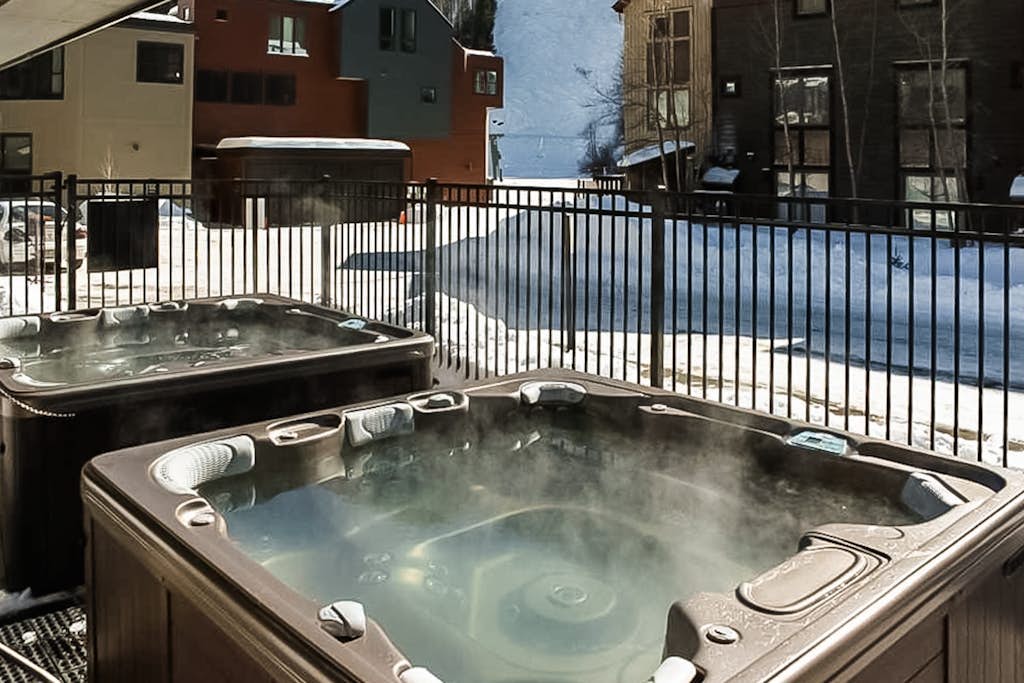 Stunning ski-in/out condo with balcony, fireplace, hot tub, & mountain views
