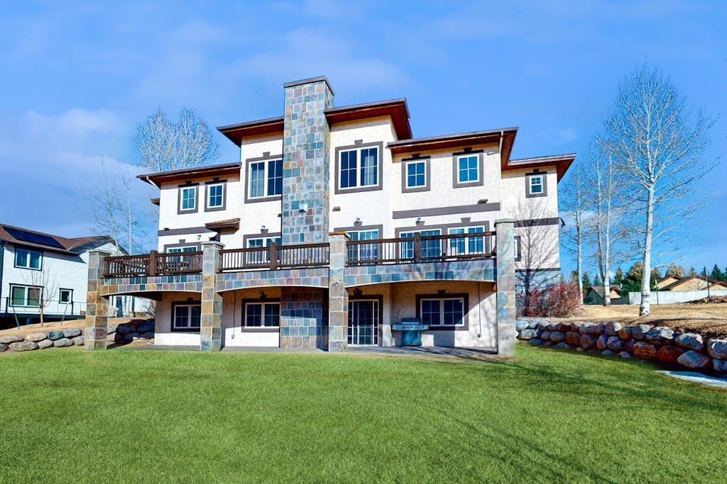 Luxe home on Gypsum Creek Golf Course with fireplace and mountain views