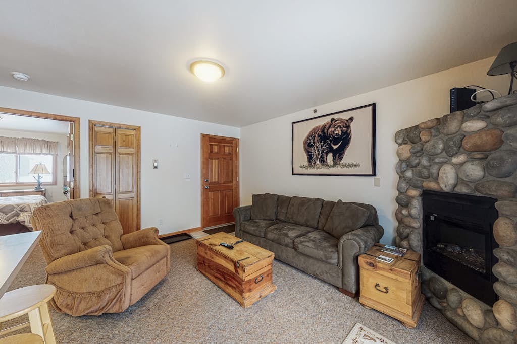 Riverfront condo with free wifi, fireplace, patio, & gas grill