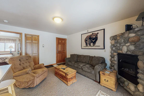 Riverfront condo with free wifi, fireplace, patio, & gas grill