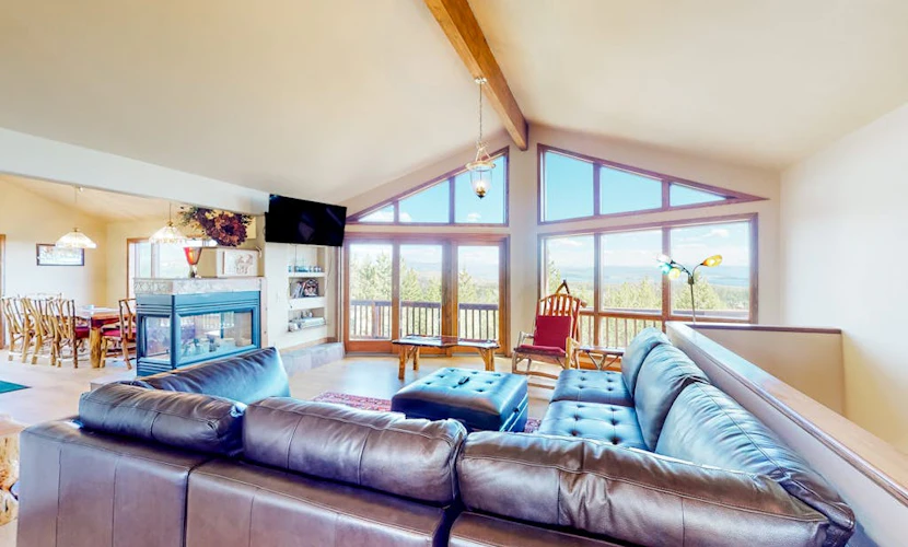 Gorgeous home with a stunning lake & mountain view, deck & gas fireplace