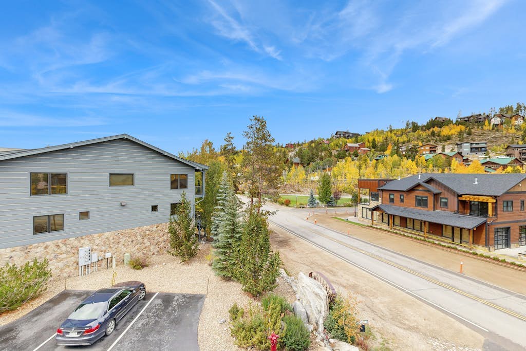 Luxe downtown condo with mountain views, balcony, grill, fireplace, & W/D