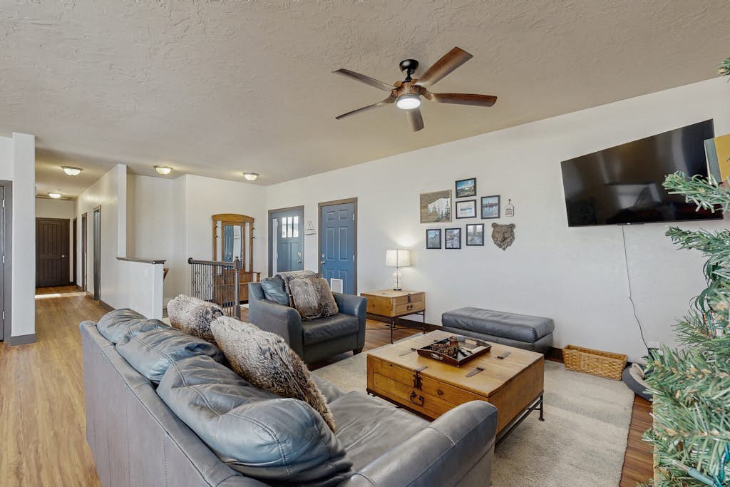 Mountain getaway with hot tub, game room, fireplace, and modern interior
