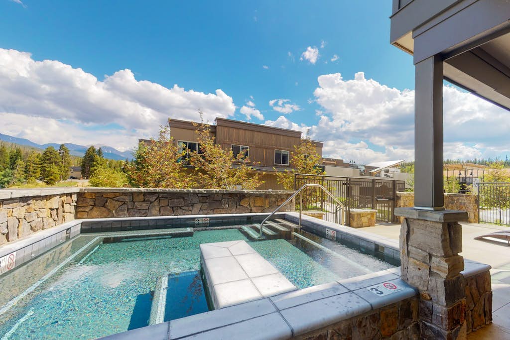 Mountain-view corner condo with hot tub access & fireplace