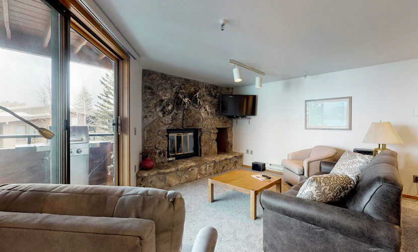 Lakefront Condo with Mountain Views & Shared Hot Tub - Walk to Town & Ski Access