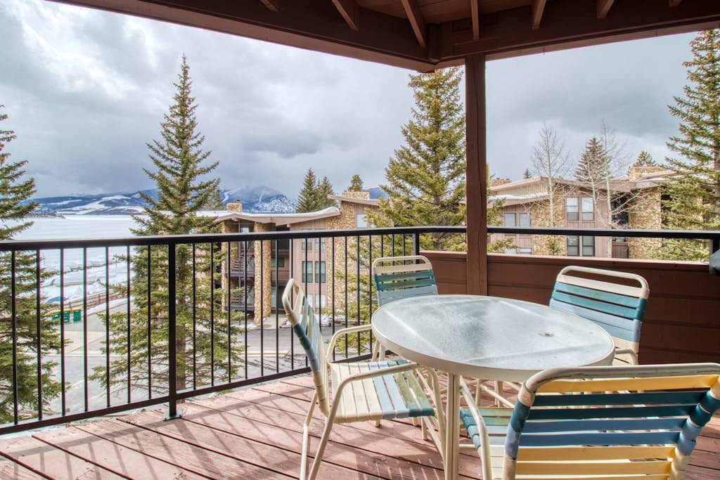 Lakefront Condo with Mountain Views & Shared Hot Tub - Walk to Town & Ski Access
