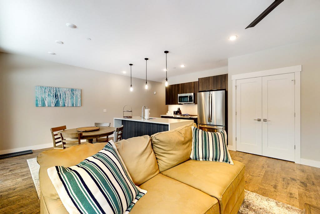 Modern riverfront condo w/ a gas fireplace, washer/dryer & private patio