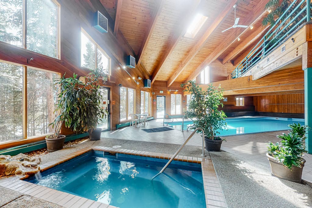 Luxurious top-floor condo with balcony, WiFi, fireplace, great views, & location