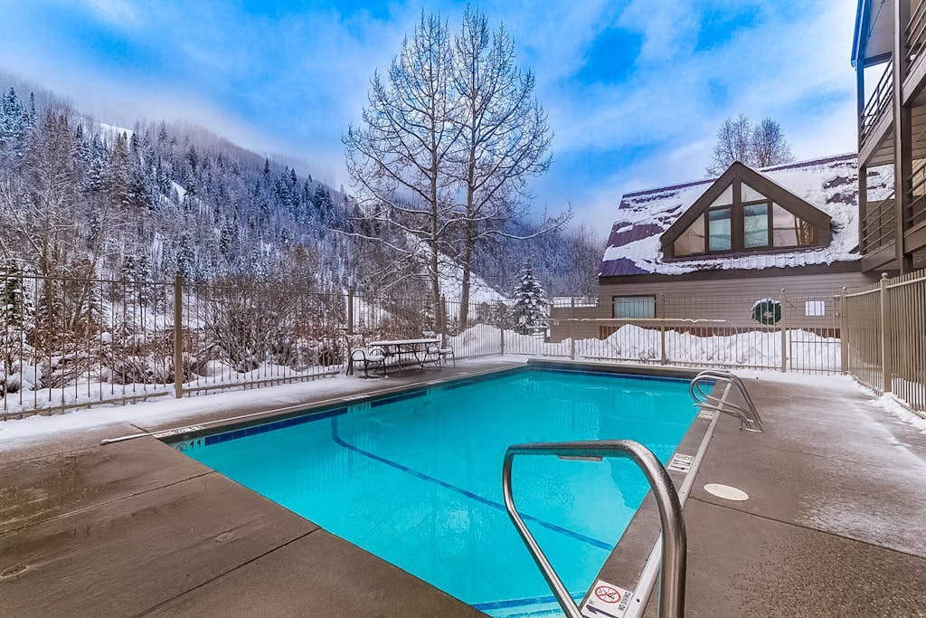 Lovely riverfront condo with seasonal pool & hot tub - in town & near the slopes
