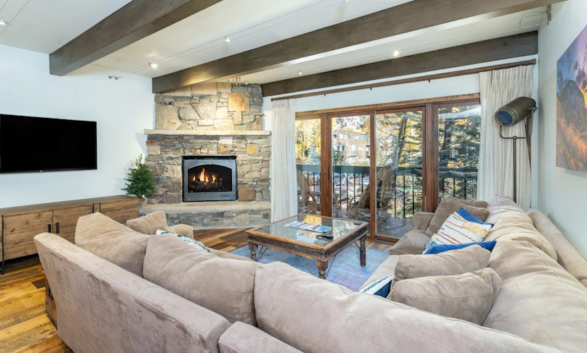 Mountain- & river-view condo with W/D & hot tub - walk to lifts & Main St
