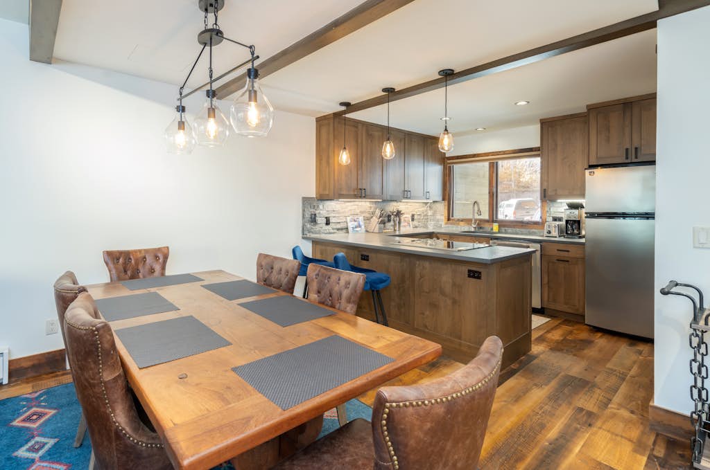 Mountain- & river-view condo with W/D & hot tub - walk to lifts & Main St