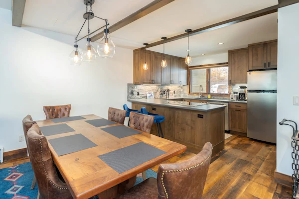 Mountain- & river-view condo with W/D & hot tub - walk to lifts & Main St