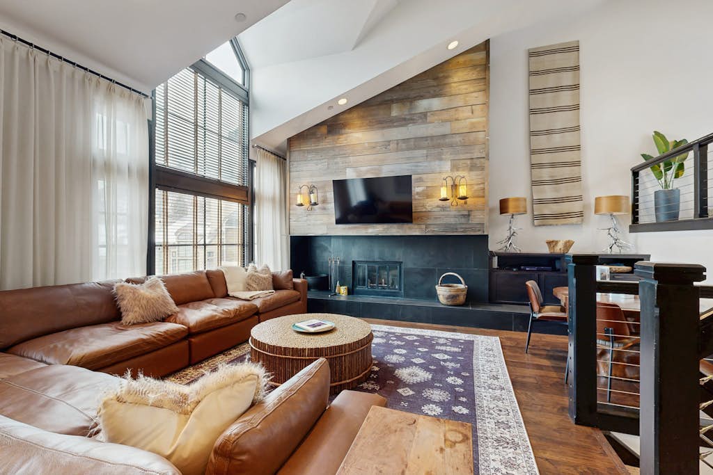 Modern retreat with wood-burning fireplace, hot tub access, and grill