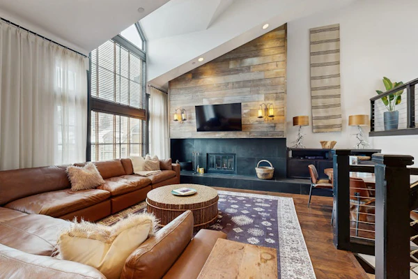 Modern retreat with wood-burning fireplace, hot tub access, and grill