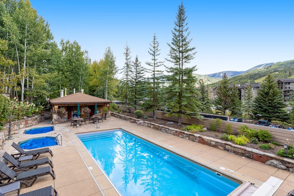 Sunlit, mountain view condo with a fireplace plus on-site pool & hot tub