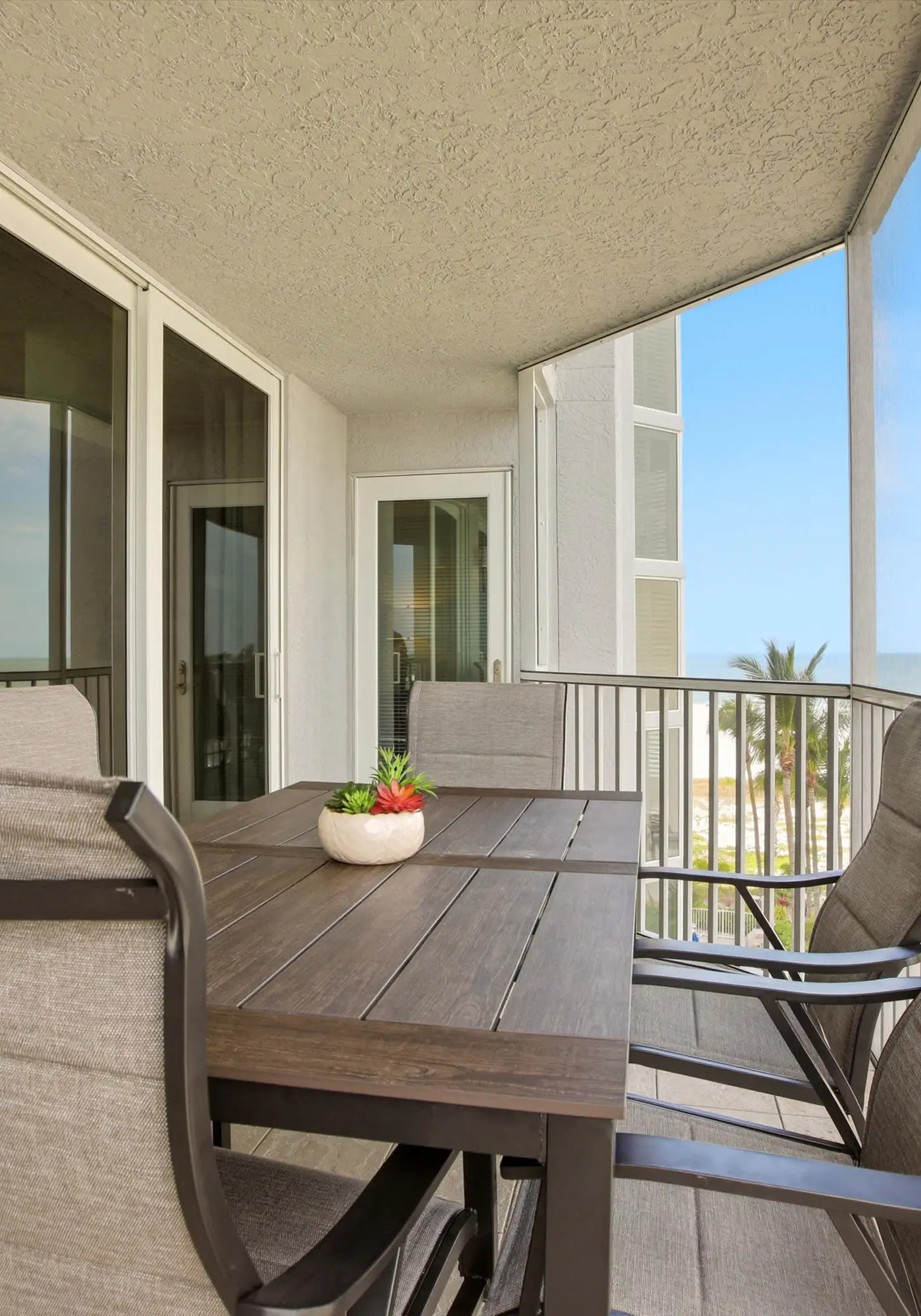 Beachfront Bliss, Cozy Condo with Patio, Pool & Stunning Views!