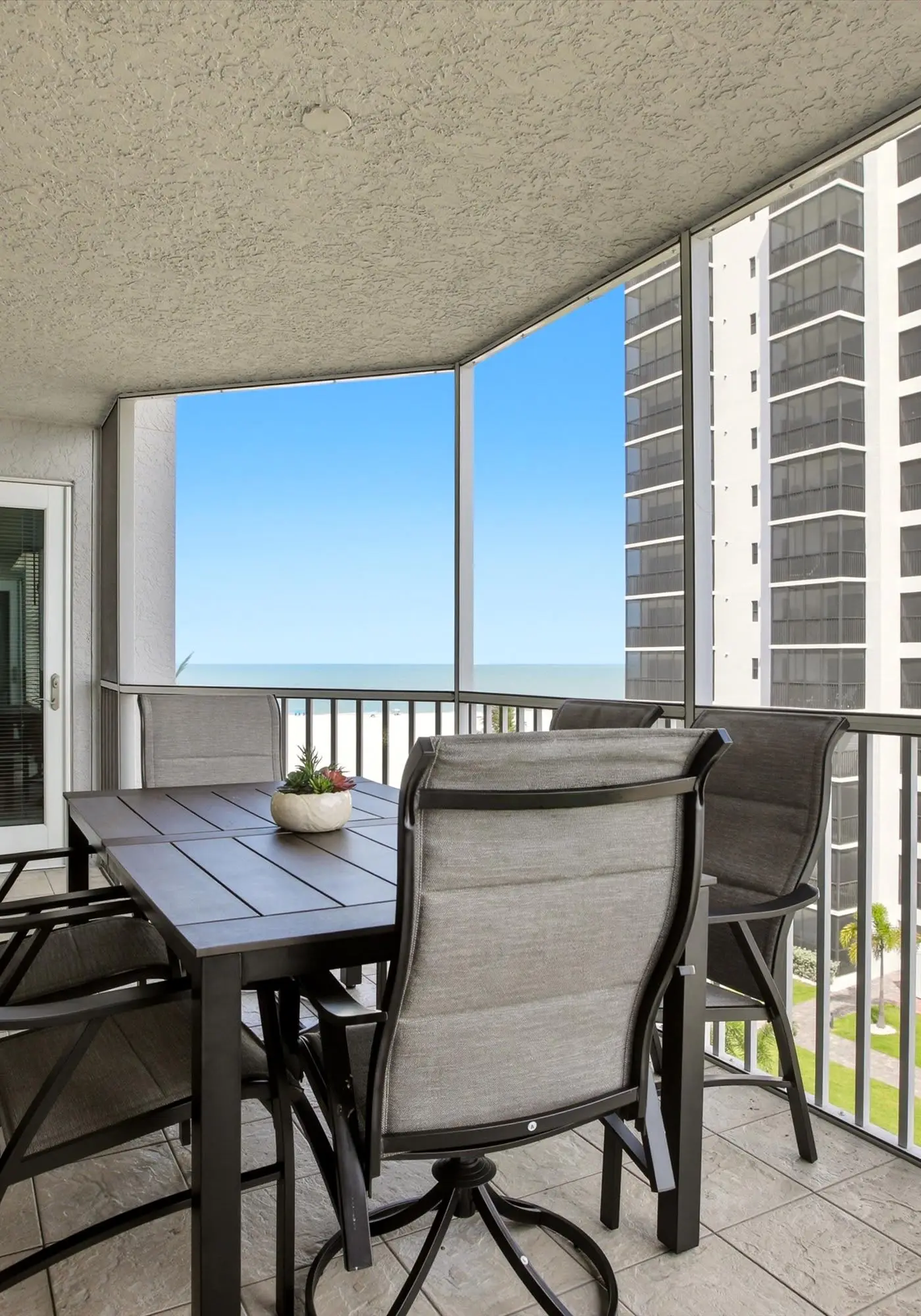 Beachfront Bliss, Cozy Condo with Patio, Pool & Stunning Views!