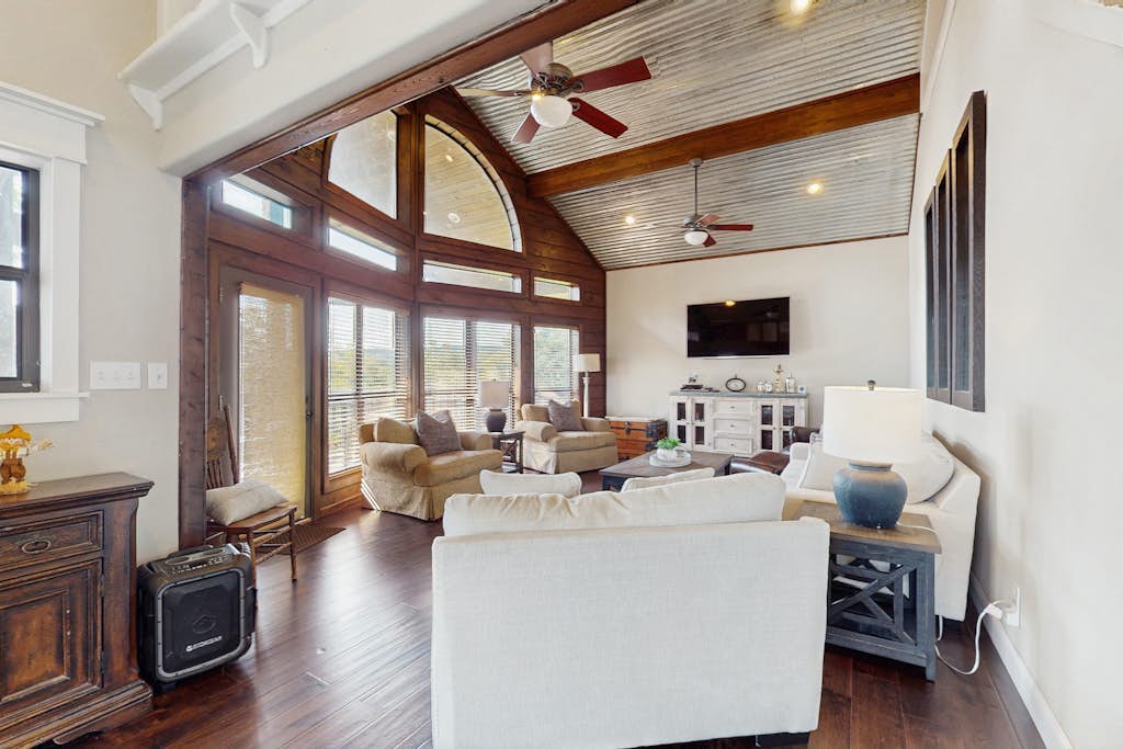 Opulent waterfront home with dock, firepit & stunning river view