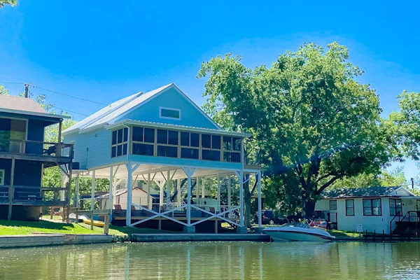 Lakefront dog-friendly home with kayaks, SUP's, huge screened porch