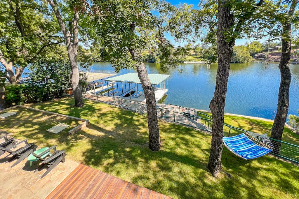 Two-story waterfront retreat with boat dock, two firepits & two kayaks