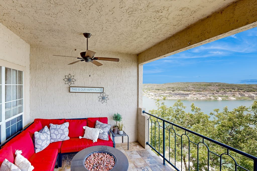 Lavish lakefront retreat in private island community with pools, tennis, & gym