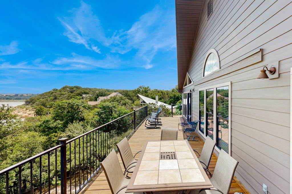 Spacious lakefront hideaway with decks, grill, billiards, tennis & pool