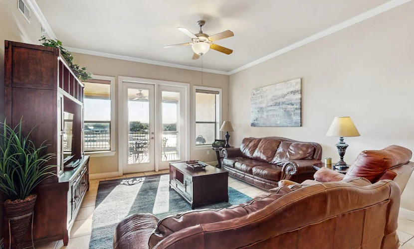 Waterfront condo with furnished balcony, central AC, & washer/dryer