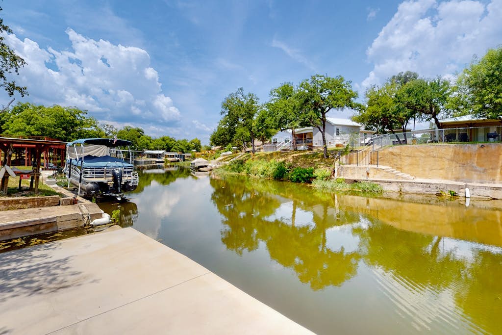Dog-friendly waterfront home with dock, grill, water views, patio, washer/dryer
