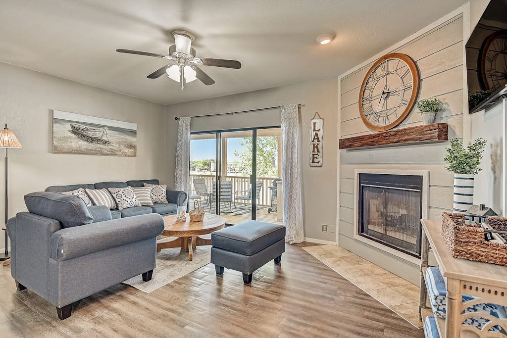 Dog-friendly water view condo with inviting porch, AC, W/D, & modern charm