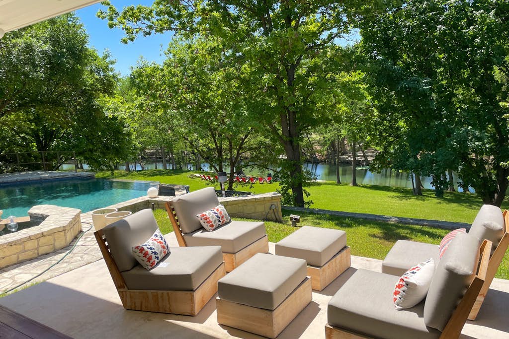 Inviting waterfront home with pool, patio, fireplace, W/D, & dog-friendly