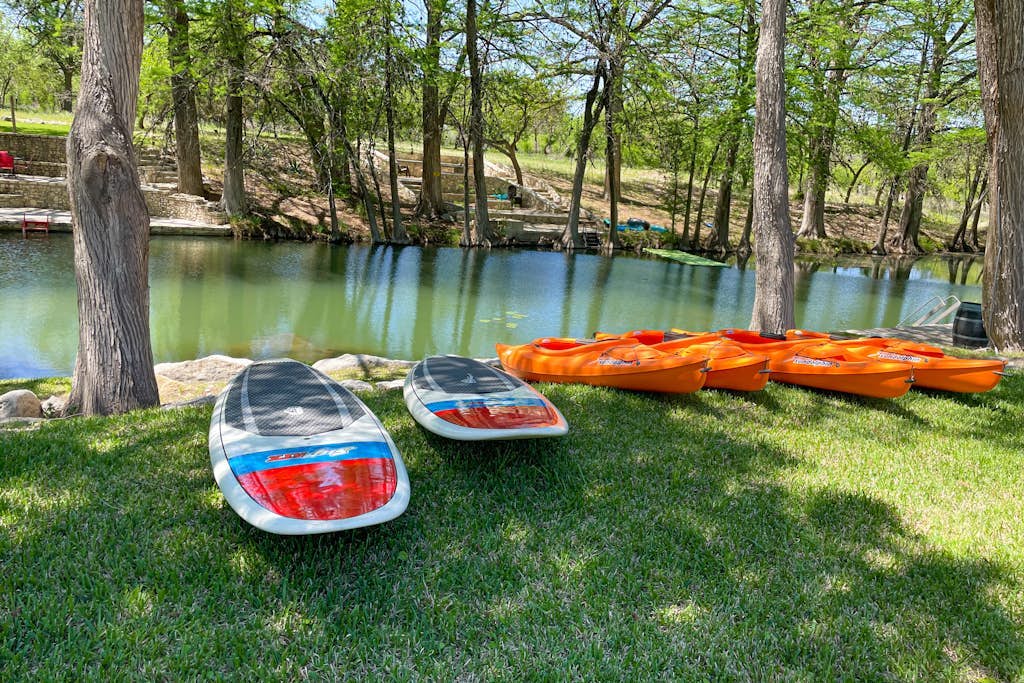 Inviting waterfront home with pool, patio, fireplace, W/D, & dog-friendly
