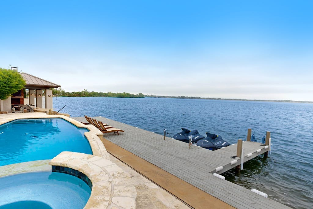 Luxe lakefront retreat with private pool, spa, lakeside terrace, gourmet kitchen