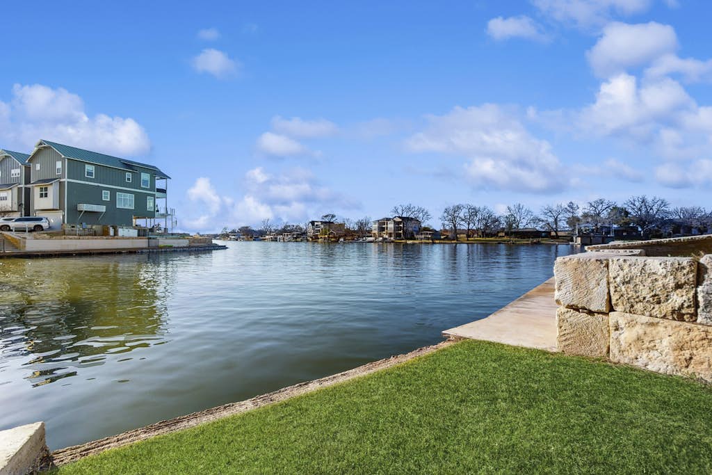 Stunning lakefront home w/ pickleball, shared pool & sand volleyball