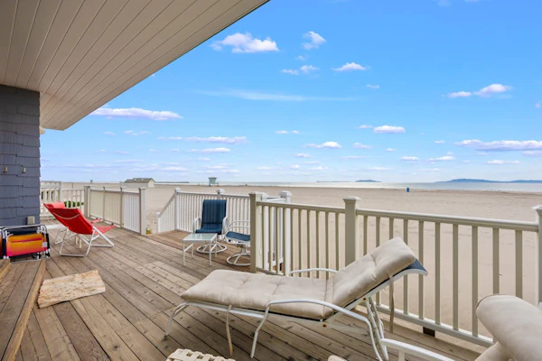 Beachfront abode with spacious deck, pool table, gas grill, smart TVs, & W/D