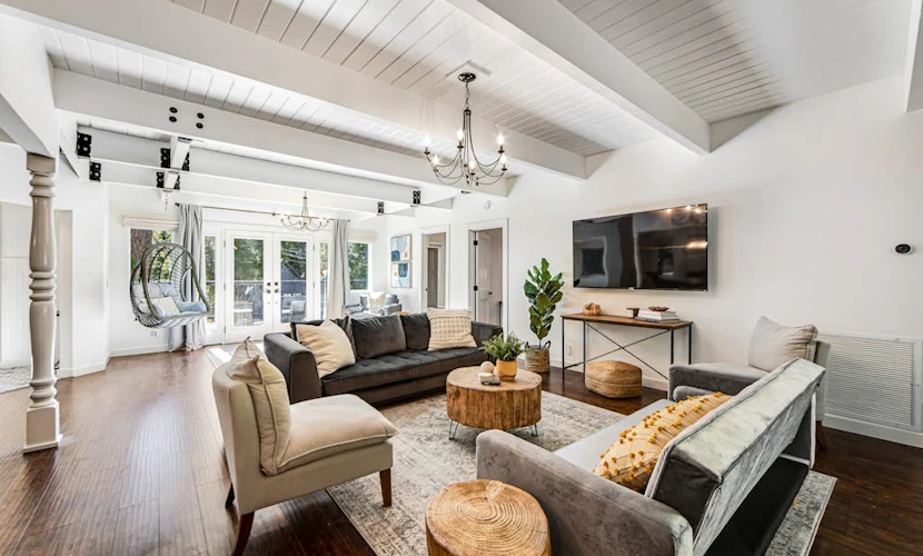 Stunning lakehouse lodge with a deck, fireplace, lush patio & lake access