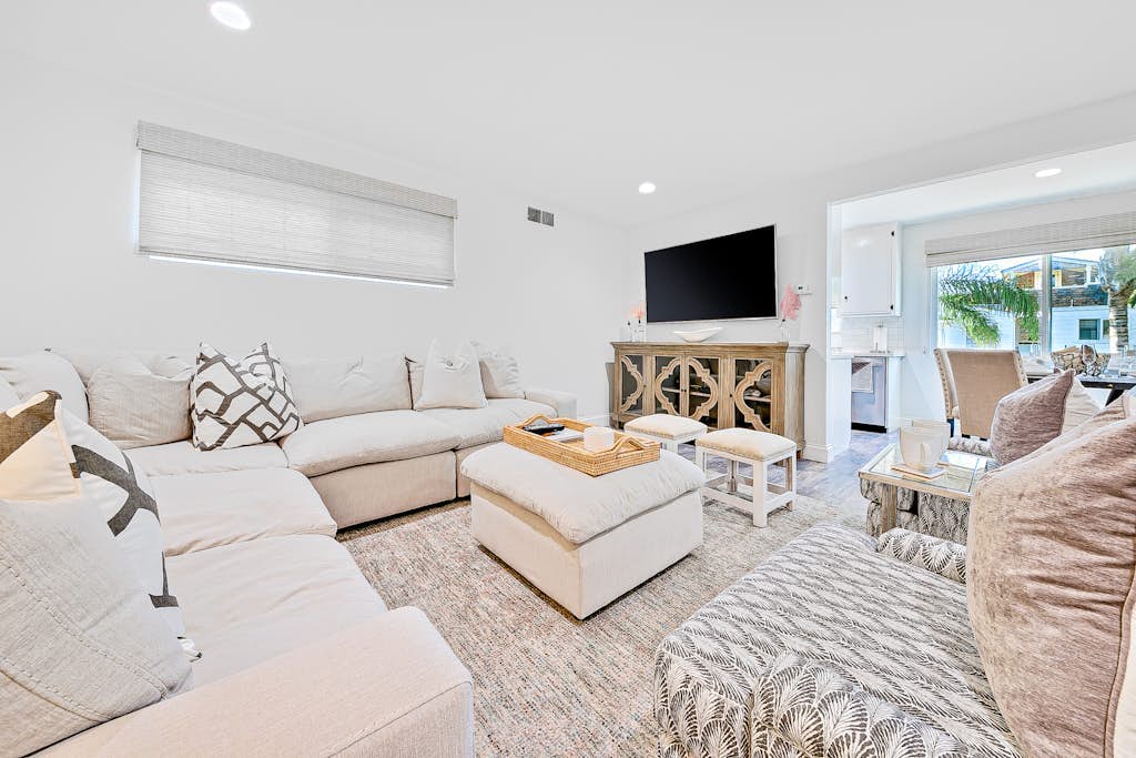 Newly remodeled home with kitchens, great location, fireplace, balcony, & patio