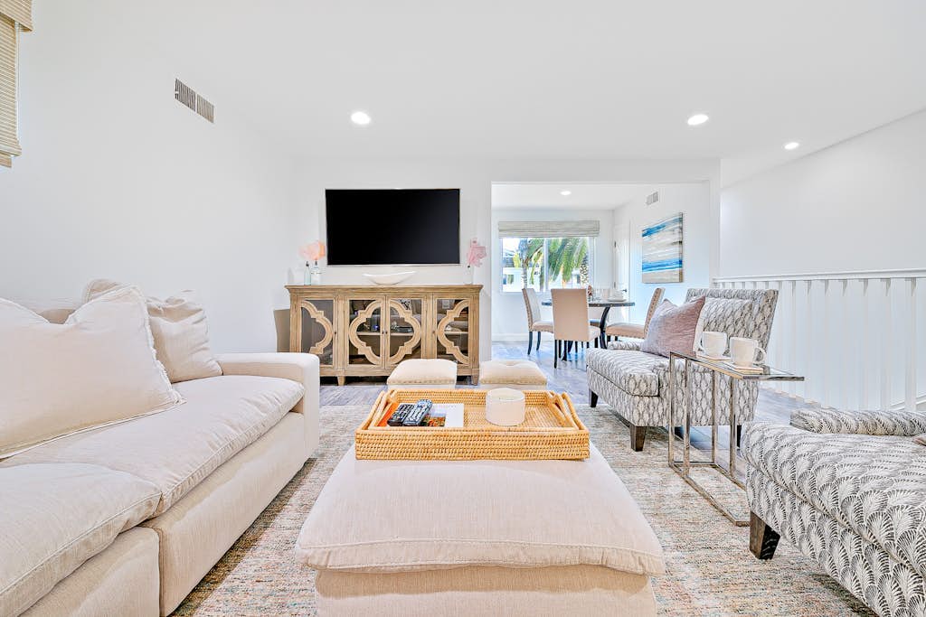 Newly remodeled home with kitchens, great location, fireplace, balcony, & patio
