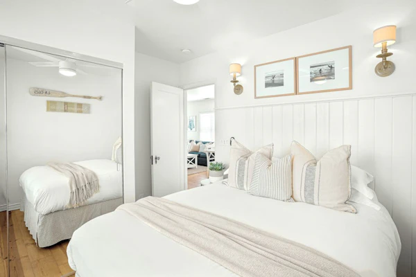 Ground-floor beach cottage with a furnished patio, AC, parking, & washer/dryer